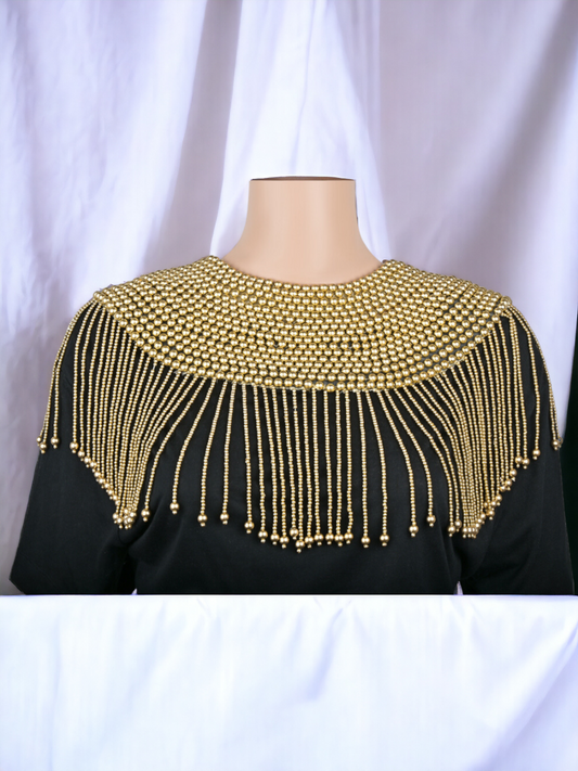 Introducing the Gold Body Chain Cape – a radiant embodiment of glamour and allure, designed to captivate the senses and adorn your silhouette with opulent sophistication. 