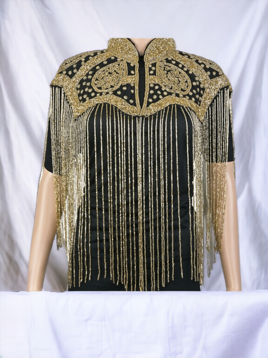 Introducing the Gold & Black Maharani Body Chain Cape – an exquisite fusion of regal opulence and contemporary allure, designed to adorn your silhouette with unparalleled elegance. 