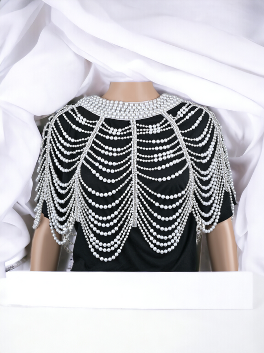 This exquisite body chain cape is a celebration of femininity, crafted with meticulous attention to detail and embellished with lustrous pearls that cascade delicately across the body.