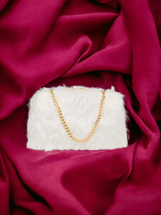 A white clutch on a plain red background. 