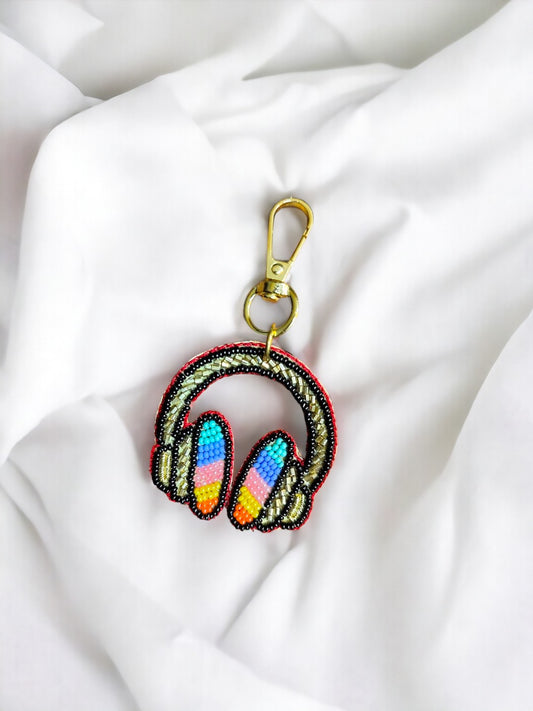 Introducing the perfect blend of functionality and style: the Headphones Bag Charm! 