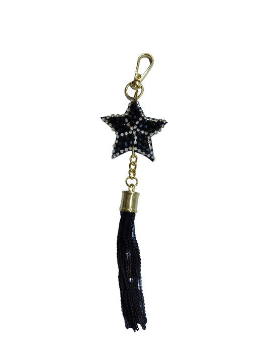 A black star bag charm that will elevate your look. 