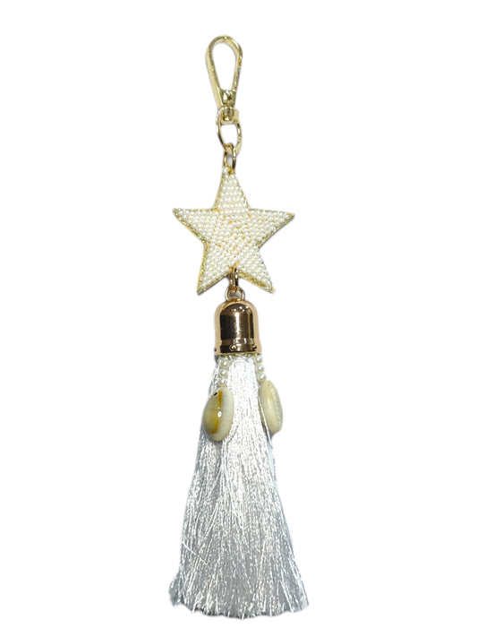This bag charm is versatile and can complement a variety of styles, from casual to elegant. 