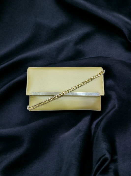 A Vdesi gold envelope clutch perfect for a formal event. 