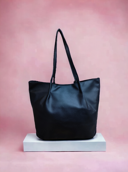 A Vdesi black tote bag on a plain background. 