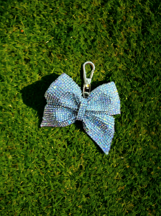 Introducing our dazzling Rhinestone Bow Bag Charm, the perfect accessory to add a touch of glamour to your everyday style. 