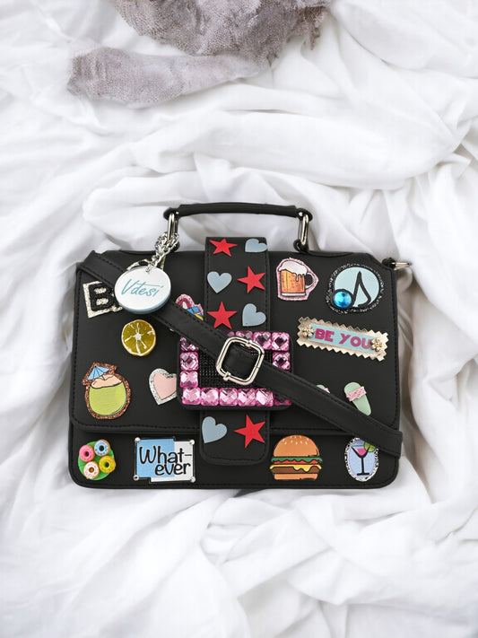 A Vdesi Black pop badges belt sling bag made of PU material with a lot of stickers on it.
