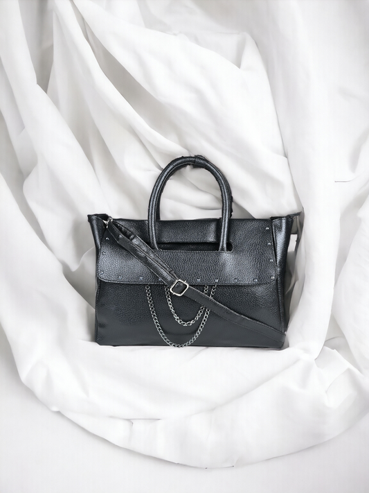 A Vdesi Black handbag on white background. 